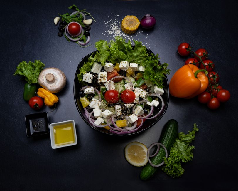 Vibrant Greek salad with feta, olives, tomatoes, and other fresh vegetables for a healthy meal.